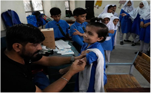 A schoolgirl receives the Pfizer- BioNTech COVID-19 vaccine at a school in Lahore on September 19, 2022 (Credit: WHO/EMRO)